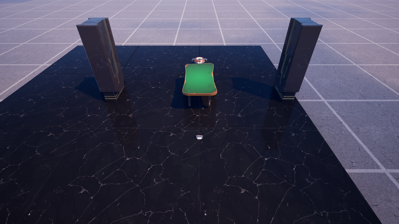 Overhead view: the green prize wheel centered between the pillars, Button in front